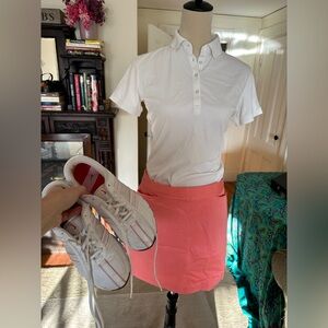 Lot of women’s golf set. S white polo, size 10 coral Skort, 7.5 Nike golf shoes.